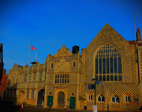 The Guildhall of the Holy Trinity, with its remarkable 'checkerboard' frontage, where Queen Street and the Saturday Market Place meet. Note also the intricate stonework above the front door and the giant window of the Great Hall.