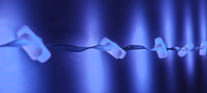 A shot of the star shaped LED lights that come with the Plasma 2350 W kit. They are blue and are pictured against a wall.