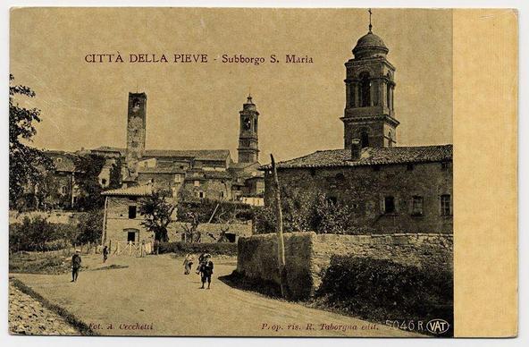 The image is a vintage sepia-toned photograph depicting the historic town of Città della Pieve in Italy, specifically showing S. Maria Subborgo area. In the foreground, we see two individuals walking along an unpaved road lined with stone walls and sparse vegetation. Further back, there are several buildings that appear to be part of a historical complex or village, including what looks like tower structures possibly serving as bell towers associated with churches.

The architecture has a rustic feel, indicative of old European towns, likely dating from the late 19th century based on the style and condition of the structures. The photo carries text in Italian that translates to "City of Città della Pieve - Subborgo S. Maria," along with other small texts indicating it's part of a series by R. Taborgna, edited by Vat.

The photograph is aged, evident from its discoloration and the wear on the edges, suggesting considerable historical value as well as aesthetic interest due to its depiction of an older time in Città della Pieve.
