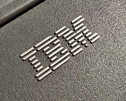 A raised IBM logo on a plastic case.