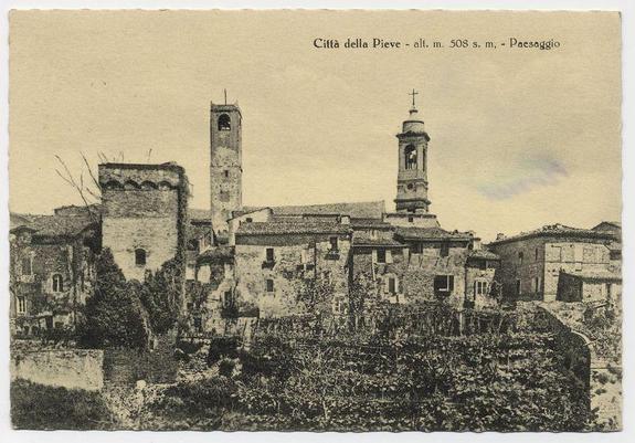 The black and white photograph depicts a historical town scene, showcasing aged stone buildings with characteristic architecture of European medieval design. Prominent features include two tall church towers adorned with spires and crosses at their tops, suggesting the presence of significant religious institutions within this community. The surrounding structures appear to be residential or administrative in nature, characterized by small windows, darkened facades, and a rustic appearance indicative of long-standing habitation.

The image is annotated "Città della Pieve - alt m. 508 s.m., Paesaggio," which translates from Italian to indicate that the town's name is Città della Pieve, located at an elevation of approximately 508 meters above sea level, and labeled as a landscape photograph. The background suggests a rural setting with sparse vegetation or perhaps remnants of former agricultural land.

The sepia-toned quality of the image hints at its age, likely capturing this scene in the late 19th to early 20th century when such photographs were popular for documenting historical landscapes and urban settings. This particular photograph seems to be part of a series showcasing various Italian towns or cities, as indicated by similar images found on external websites.

The overall impression is one of antiquity and preservation, with the architecture representing an era w [...]