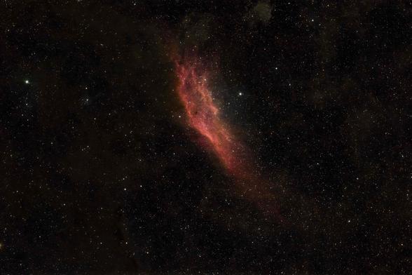 Nebula stretching up and down the screen, that very much resembles the state of California on a map. Lots of reds and oranges and yellows in the image.