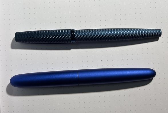 Two blue pens