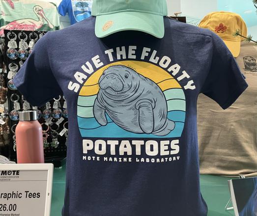 A T-shirt for sale that says Save the Floating Potatoes. It has a nice illustration of a manatee and also says, in small letters, MoteMarine Laboratory.