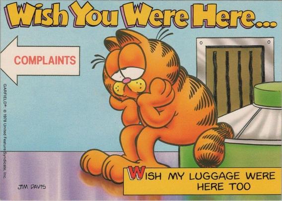 his humorous vintage postcard features the comic-strip character Garfield, created by Jim Davis, in a classic late-1970s/early-1980s illustration style. Garfield sits slumped beside an airport baggage carousel, looking bored and frustrated while a sign points toward “COMPLAINTS.” The postcard plays on the familiar travel mishap of lost luggage, with the caption “Wish You Were Here… Wish My Luggage Were Here Too.” Licensed by United Feature Syndicate, the card reflects the era’s popularity of using well-known cartoon characters for travel and novelty postcards, often sold in airports, gift shops, and tourist destinations.