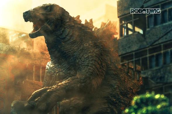Godzilla storms through a city fire smoke and sunlight silhouette him amongst the broken buildings