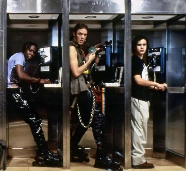 Lord Nikon, Cereal Killer and Joey in three separate phone boxes in the 1995 movie Hackers.