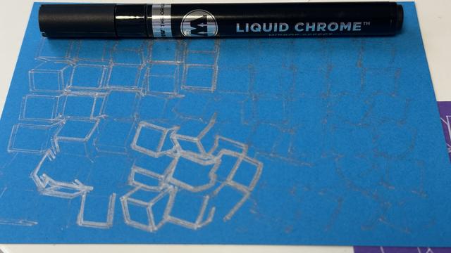 blue postcard with silver drawing on it, except that the pen has started to draw very faintly due to insufficient paint flow