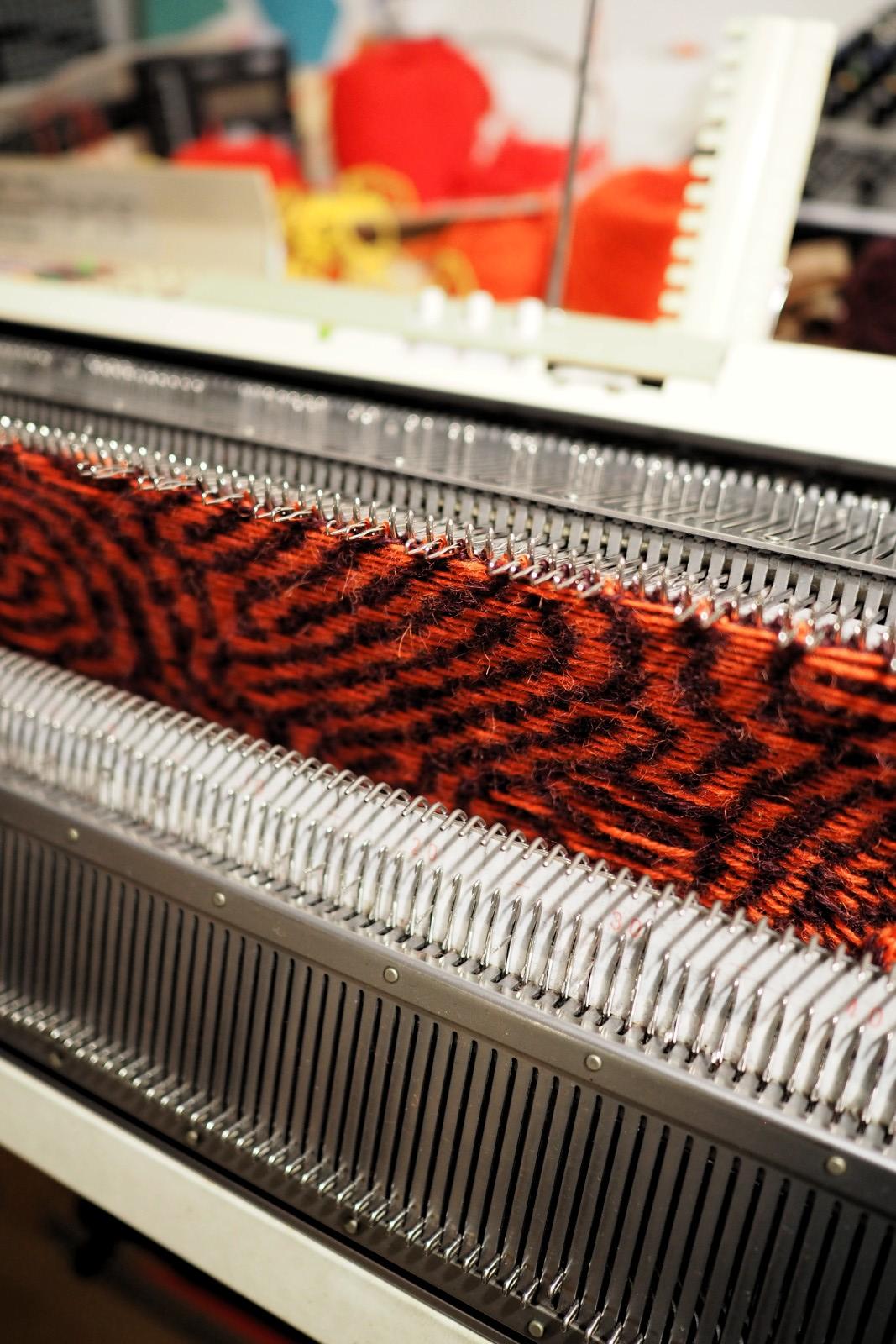 Close up of the bed of a knitting machine