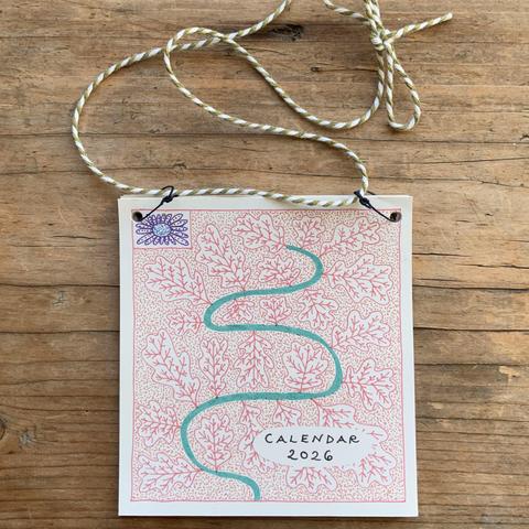 The cover of an illustrated calendar with red oak leaves.