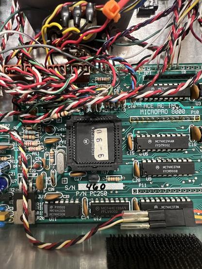 The inside of the transmitter showing the Motorola main processor in its socket. The sticker on the processor is dated 9-90.