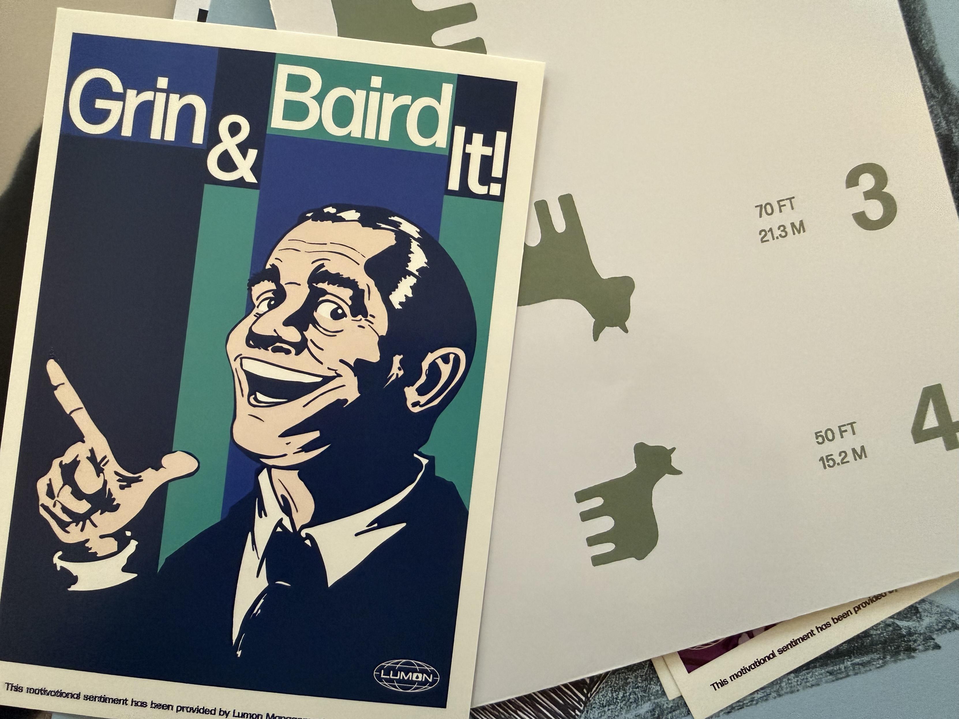 A mini poster from the TV series Severance (“Grin & Baird It!”) and a goat eye chart.