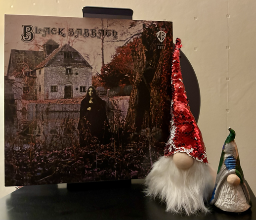 A ghostly figure lurks in a garden stealing brambles.