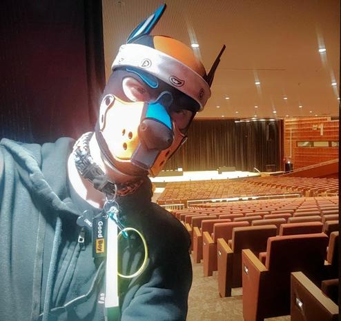 Aki in front of the door of a big undisclosed event location