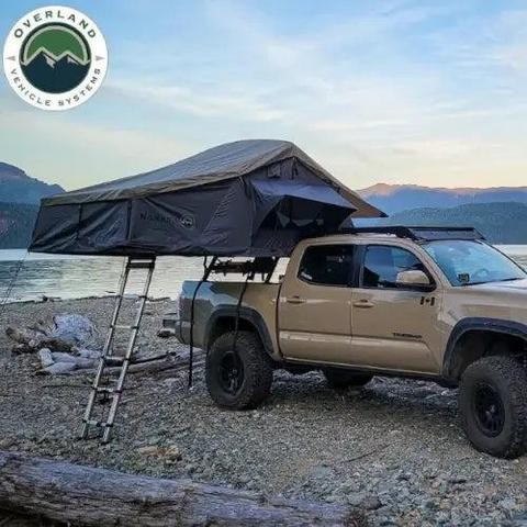 Picture of an Overland vehicle tent mounted over the bed of a pickup truck.