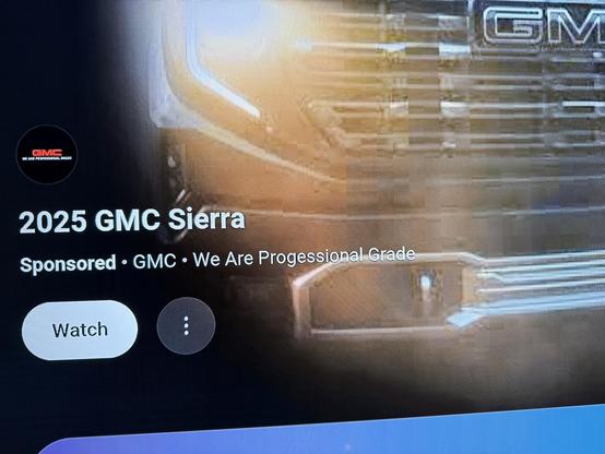 Ad on YouTube/Roku for 2025 GMC Sierra, showing the front end of a large pick-up truck with the misspelled tagline "We Are Progessional Grade"