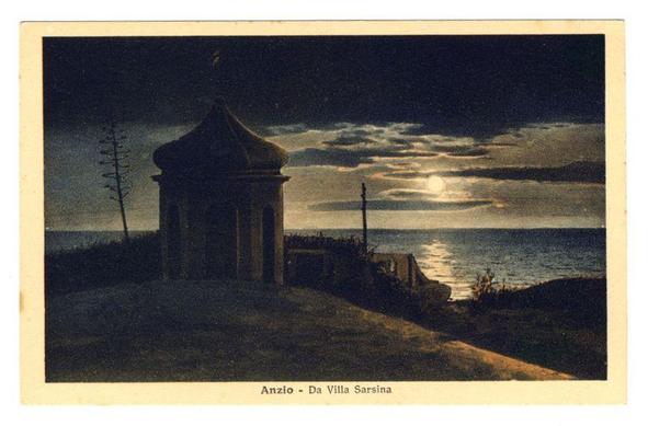 The image depicts a night scene with a small, dark structure that appears to be an old building or tower. It has a simple dome-like roof and stands prominently in the foreground on what looks like a path or road leading towards it. The background features a tranquil sea under a moonlit sky, where the reflection of the bright moonlight is visible on the water's surface. Overhead power lines run parallel to one side of the tower, adding an element of modernity to this otherwise historical setting.

The overall color palette consists mainly of dark and muted tones with shades of blue, brown, and grey dominating the scene. The contrast between the dimly lit building in the foreground and the brighter moonlit sea creates a serene atmosphere that is both mysterious and calming. There are no discernible figures or people present in this image.

The text "Anzio - Da Villa Sarsina" suggests that this location might be Anzio, an Italian town known for its historical significance during World War II, specifically as the site of Operation Shingle (the Battle of Anzio), a major Allied military operation. The mention of 'Villa Sarsina' could refer to a specific villa or estate in Anzio.

The image seems like it is from an old postcard or illustration due to its style and presentation, possibly dating back several decades ago when such imagery was commonly used for travel souvenirs or a [...]