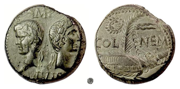This coin depicts Augustus together with Agrippa while the reverse bears the inscription COL NEM which stands for Colonia Nemausus (Nîmes). Obverse: Augustus with Agrippa in Janus style portraits. Augustus wears the oak leaf wreath. Reverse: COL NEM with a crocodile and palm frond topped with a wreath.  This example is thought to date from circa 16-10 BCE. References: RPC I 524; RIC I 158. Photo credit to VCoins.