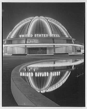 The image captures the iconic United States Steel building at night, part of an exhibition during a World's Fair. The black and white photograph highlights the illuminated structure with its distinctive curved design, which reflects on a body of water in front of it.
In this scene, you see "United States Steel" prominently displayed across the top portion of the dome-like architecture, indicating that it was sponsored by U.S. Steel for their exhibition during an exposition event held around 1939. The reflection creates a symmetrical visual effect on the still water surface below, enhancing the overall aesthetic appeal.
The photograph is credited to Gottschalks-Schleisner with a reference number of "691e" and was part of negatives taken by this company for archival purposes or photography collections during that era. The size mentioned as 4x5 in suggests it's an enlarged negative used for printing large photographs, which could be indicative of the importance or scale of exhibitions at World's Fairs held back then.
Overall, this image offers a glimpse into past technological achievements and architectural designs from the time period when such events were prominent showcases for industrial progress.