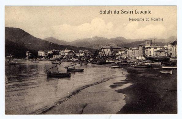 The image shows a monochromatic postcard featuring an old photograph of the coastal town Sestri Levante, Italy. The scene captures several wooden boats moored at low tide in what appears to be a harbor or marina area. In the background are buildings and structures indicative of a historical European seaside village with mountains looming over it under a cloudy sky.
There is text on top of the postcard that reads "Saluti da Sestri Levante" which translates to "Greetings from Sestri Levante," followed by smaller text stating "Panorama da Ponente." This indicates that the photograph depicts an evening panorama or view facing west. The overall appearance suggests a historical context, possibly early 20th century given the style of boats and buildings.
Additional information about this image can be found on a website with the URL provided in the alt text: https://images.loener.nl/FerroCandilera/full/6730/6730994f89b10e7a26b65775.jpg. This link likely directs to more details or history about the photograph and its creator, Ferro Candilera.