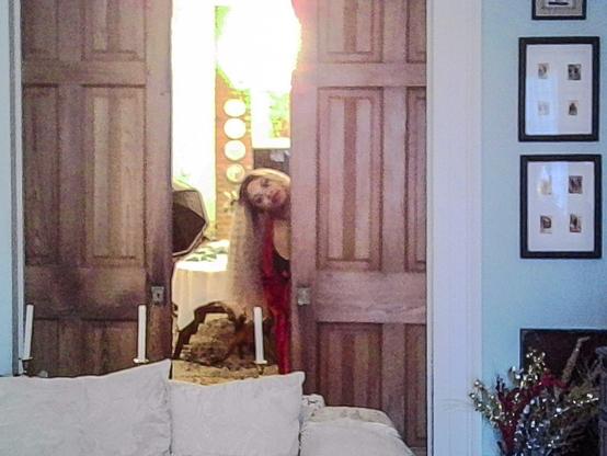 Kodak Charmera shot of a model peeking from behind a door.