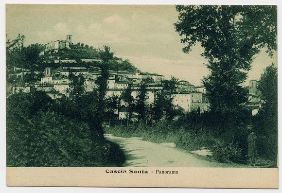 The image displays a vintage postcard with the title "Cascia Santa - Panorama" at its bottom. The photo captures an old village scene, likely from several decades ago judging by the style of the buildings and vegetation. A winding dirt path leads up to what appears to be a higher elevation where clusters of houses are densely packed on a hillside. These structures vary in design but generally feature sloping roofs typical for hilly terrain or historical European architecture.
The photo is monochromatic, suggesting it's either an old print or styled as such; the buildings and trees exhibit shades ranging from dark green to grayish-white, with varying levels of saturation that give depth to the scene. The sky above has a uniform tone, indicating overcast conditions when the picture was taken.
In terms of context, this image is associated with Cascia, likely referring to Castiglione di Sicilia in Italy known for its historical landmarks and picturesque landscapes. Given the reference "FerroCandilera," it may be linked to an event or a notable structure within that region during the era when such postcards were prevalent.
The bottom of the card has a plain, unadorned tan strip, which is typical in vintage cards for practical reasons like protection and durability. This part likely corresponds with where one would fold the card if it was meant to be sent as mail.