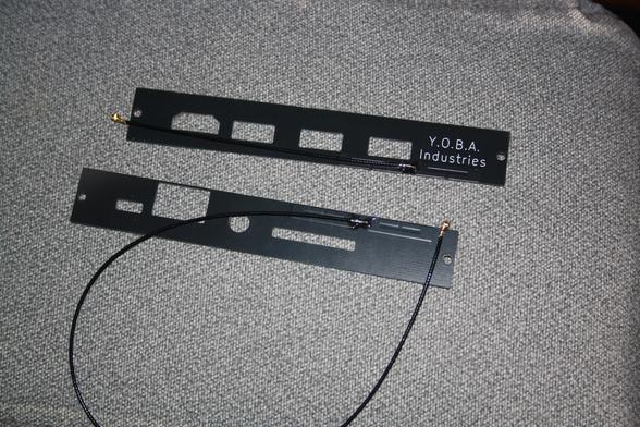 two black FR4 mnt reform port cover pcbs with coaxial pig-tails soldered