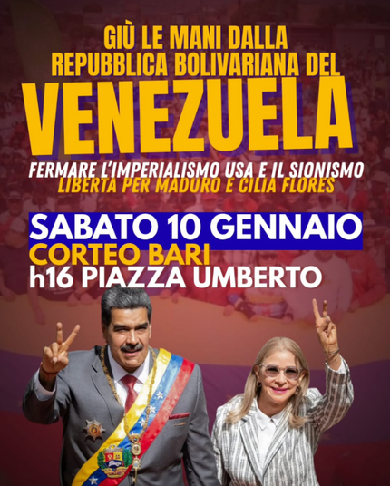 Nicolas Maduro e Cilia Flores fanno il segno di V di Vittoria con la mano durante un corteo