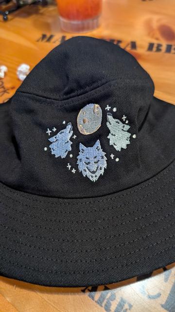 Black bucket hat with Scruffy Turtles art.