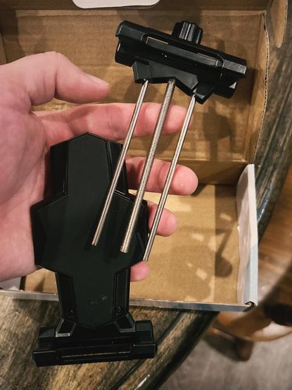 The most annoying part was getting the long threaded central screw on the top half of the mount to screw into the bottom half while keeping the two side stabilizing bars in line with their holes.