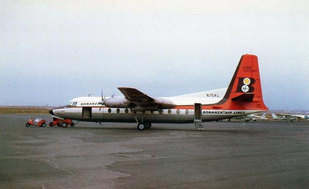 The postcard shows a side view of a turboprop passenger airplane parked on an airport ramp. The aircraft is a Fokker F-27 Friendship operated by Bonanza Air Lines, with the registration number N754L painted near the tail. The fuselage is silver with “Bonanza” written near the front and “Bonanza Air Lines” along the rear. The vertical tail is painted bright red with black and white Bonanza branding. The plane has high-mounted wings with two propeller engines, one on each wing. A small red ground vehicle is positioned near the nose of the aircraft. The background is flat, open airfield terrain under a pale sky, with no terminal buildings visible.