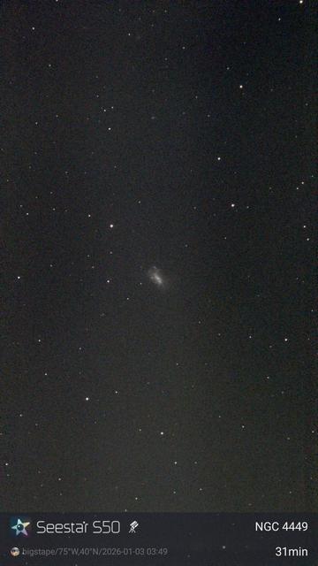 A smudge of a galaxy against a starfield