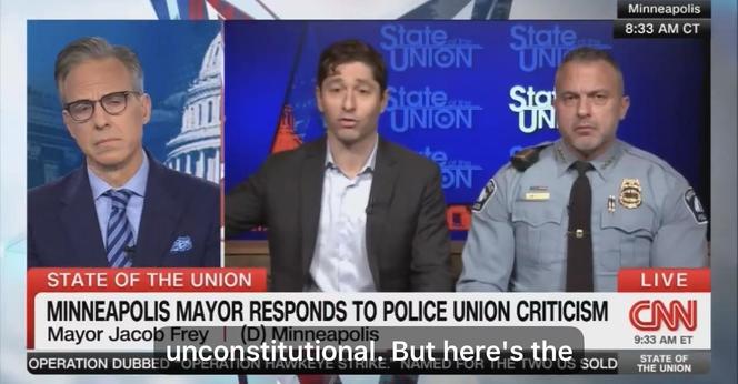 A television broadcast featuring the Minneapolis mayor, Jacob Frey, responding to police union criticism. He is flanked by a police officer, and a host is visible on the left. The backdrop displays the "State of the Union" logo. Text: unconstitutional….