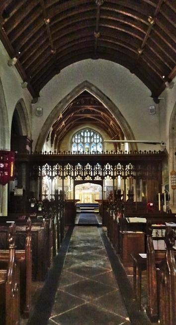 Aisle, rood screen & altar.