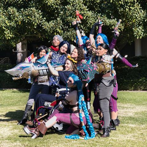 League of Legends gathering of about a dozen people in various cosplays related to Arcane.