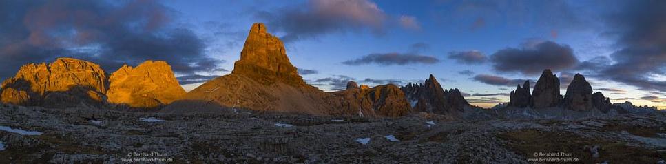 This panorama was merged from 7 single shots taken at sunset near Gwengalpenjoch. After post-processing in Lightroom and merging I masked the sky fpr fine tuning of colours and contrast.
View goes from Weißlahnspitze (left end) over Schusterplatte to Toblinger Knoten (closer to the foregrond and therefore appearing higher), Sextener Stein and Paternkofel up to Drei Zinnen | Tre Cime at the right side.