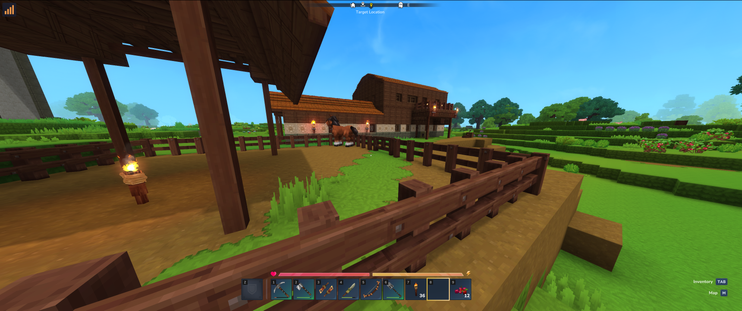 A first-person view in a blocky-style video game, showing a horse enclosed in a wooden pen with a torch on a post in the foreground; a house is in the background, with a tiered garden and green foliage on a bright, sunny day.