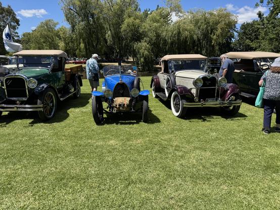 A classic Bugatti between two old cars of similar vintage - 1920s?-30s