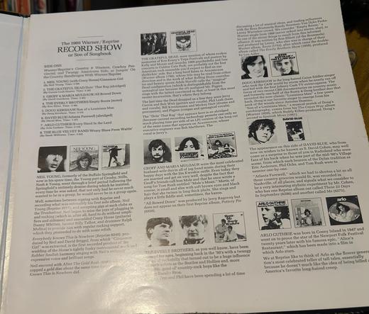 A black-and-white sheet of paper with text and images about music bands and album reviews, including The Grateful Dead, Neil Young, Dave Blue, and Arlo Guthrie.