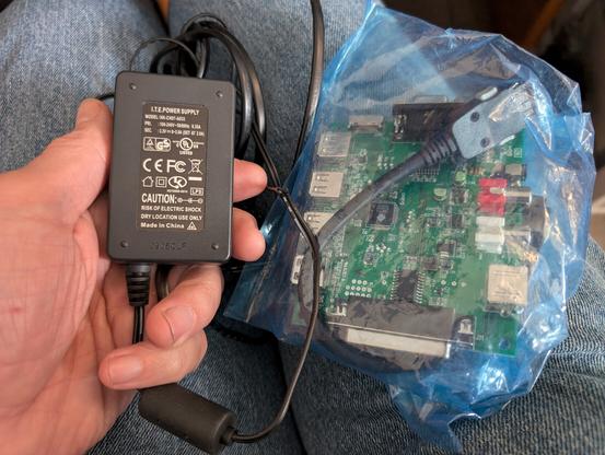 A GP2X breakout board and power supply.