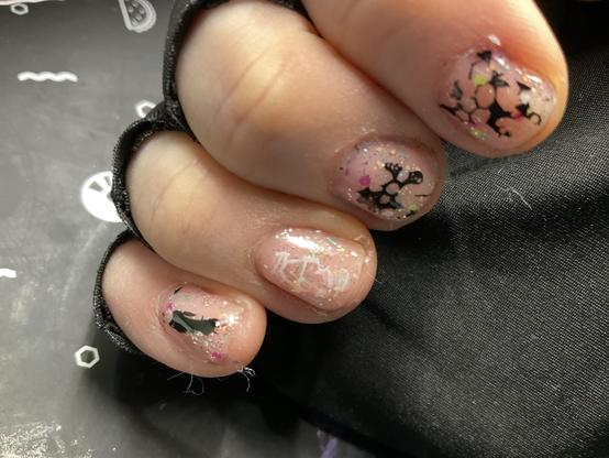 Curled fingers of my right hand with patchy foil