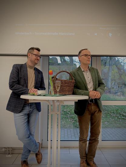 Grußwort von Dr. Denis Alt und Markus Stein am Rednertisch.