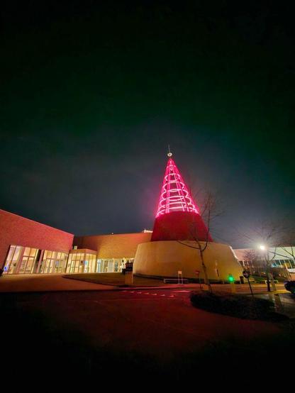 The technopolis building, with it's iconic lit-up tower in front of the building