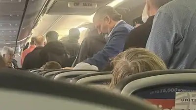 Photo from a passenger on a United Flight to the seaside resort city of Laguna Beach, California of Senator Ted Cruz boarding the flight. His office has confirmed the photo.