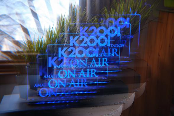 An illuminated light with my ham radio call sign, echoed by the filter.