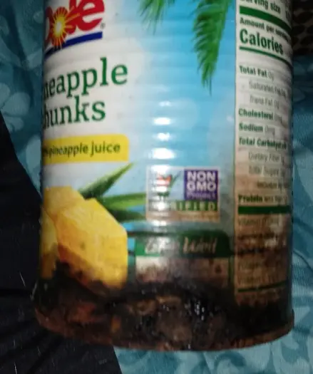 close up of the hole in the bottom of the can