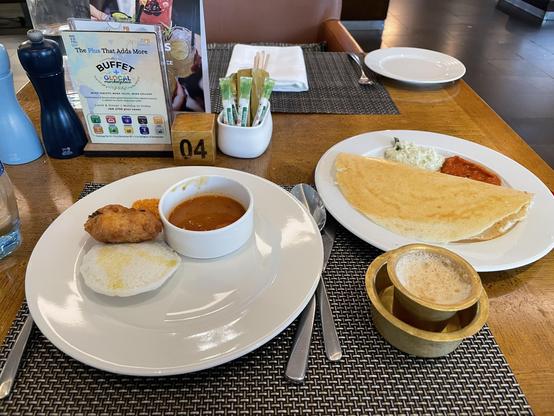 Breakfast part one. Left: plain idli, vada, with sambar. 

Right: dosa with coconut chutney

Bottom right: filter coffee in brass cup