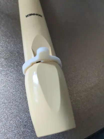 Photograph of the 3D printed mute flute attached to the flute.