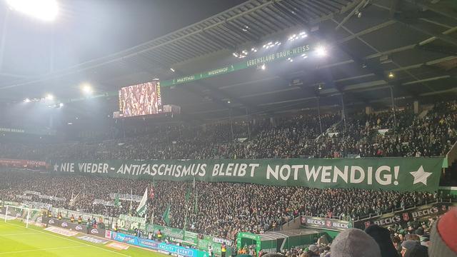 A banner above Werder Bremen’s Ostkurve:

"Antifascism is still necessary!"

Among the banners held by the club's fan and ultra groups:

"Never again Auschwitz!"
"Fight antisemitism!"
"Remembering is not enough!"