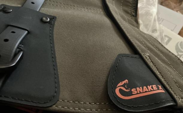 Snake gaiters showing a Snake X logo of a snake with fangs ready to strike.